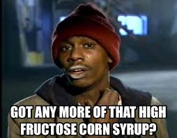 Dave Chappelle with white on lips. Words on meme "got any more of that high fructose corn syrup?"